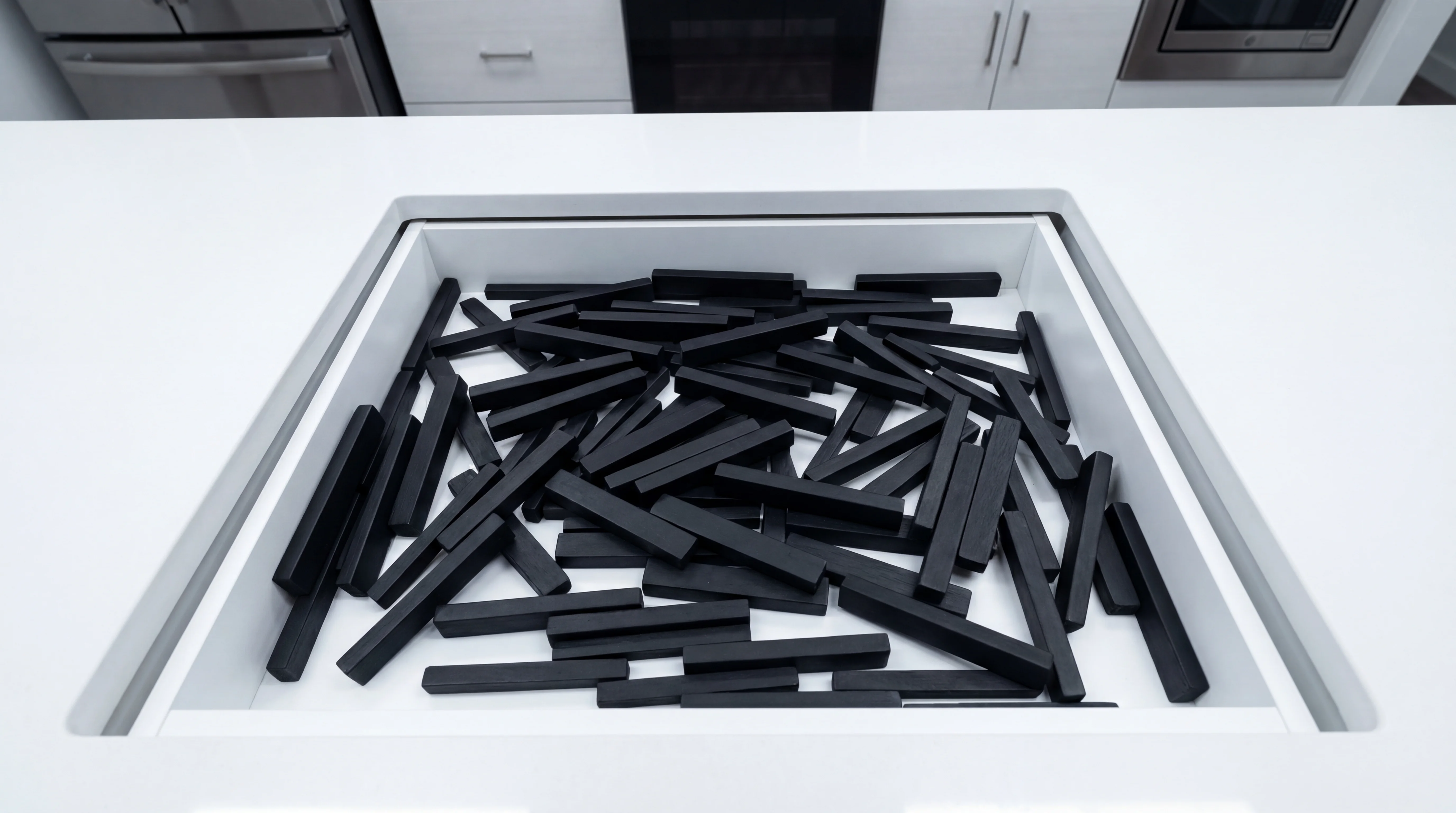 A kitchen drawer full of identical black em dashes
