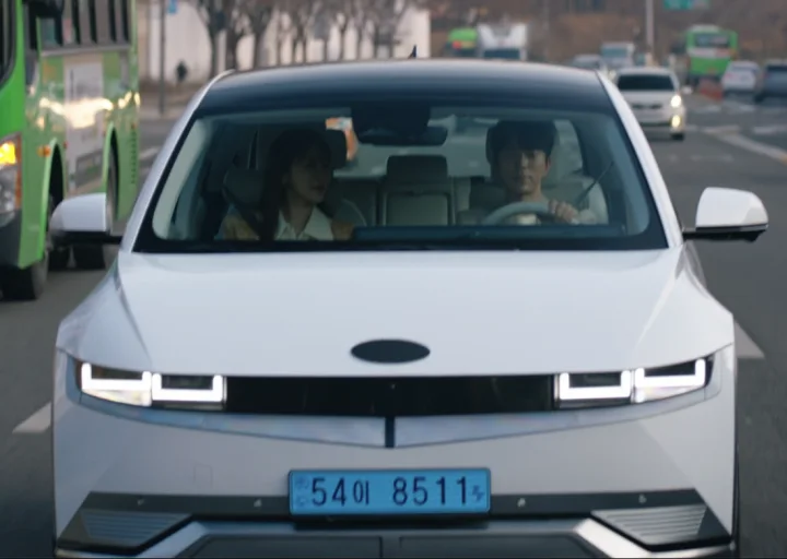 A white Hyundai Ioniq 5 with the front Hyundai badge covered by a plain black oval